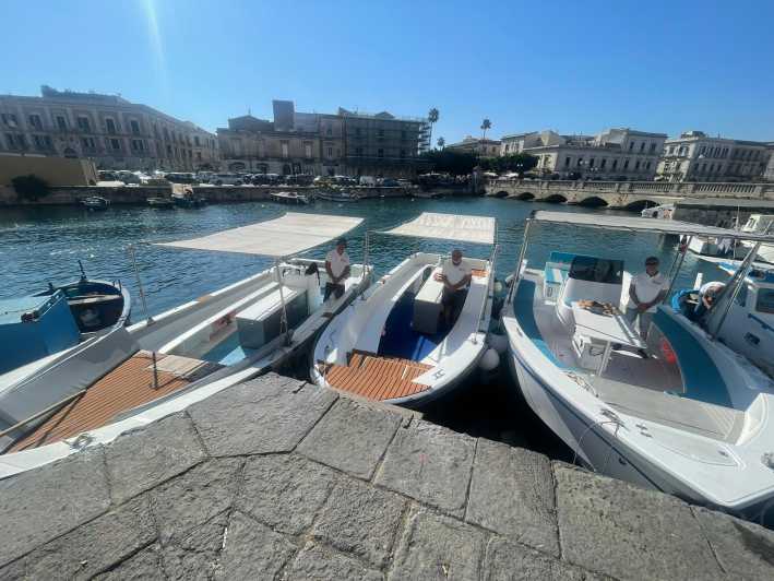 2.5-HOUR BOAT TOUR ORTIGIA+SEA CAVES+PILLIRINA+FRUIT DRINK - Cala Rossa and the view toward Ortigia