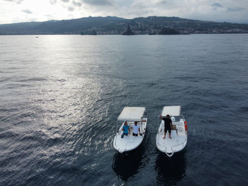 boat tour exploring and searching for dolphins in Acitrezza - The Faraglioni rocks and the story of Polyphemus