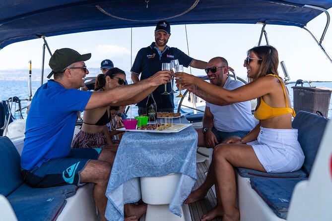 Catania boat tour along the coast with aperitif and snorkeling - Aci Castello and its volcanic shore