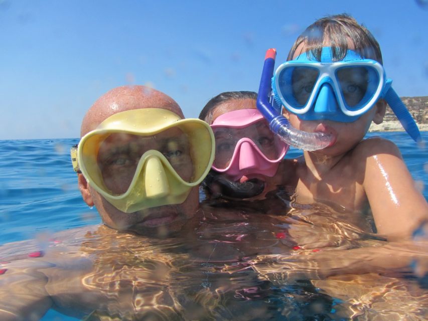 Catania, Isole Ciclopi: Snorkeling Trip - Entering the water at Aci Castello