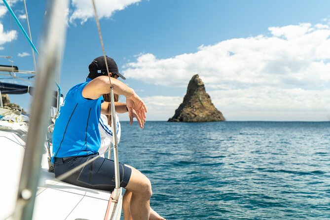 Catania: Sail Cyclops Coast by Boat and Enjoy a Sicilian Aperitif - Cruising the black lava coast from Catania