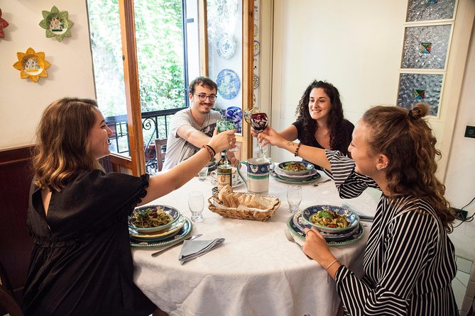 Cesarine: Home Cooking Class & Meal with a Local in Catania - Sharing the meal with local wine