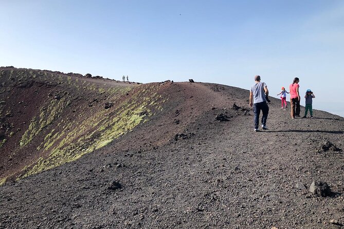 Etna, Acicastello and Acitrezza - Inside a lava-flow cave with helmets and torches