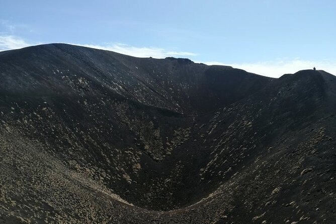 Etna Morning Trip - Inside a lava cave with a helmet and headlamp
