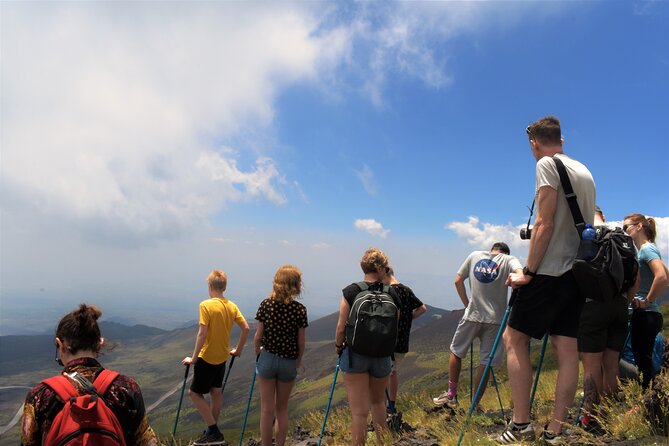 Etna's Hidden Gems - Trek Valle Bove & Lava Tunnel with Gear - Entering an Etna lava tube with a helmet and flashlight
