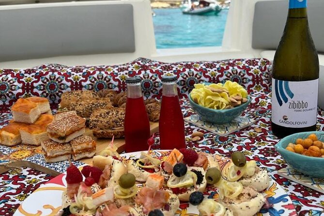 Favignana inflatable boat tour, wine tasting, snorkeling and relaxation - One hour in Favignana town