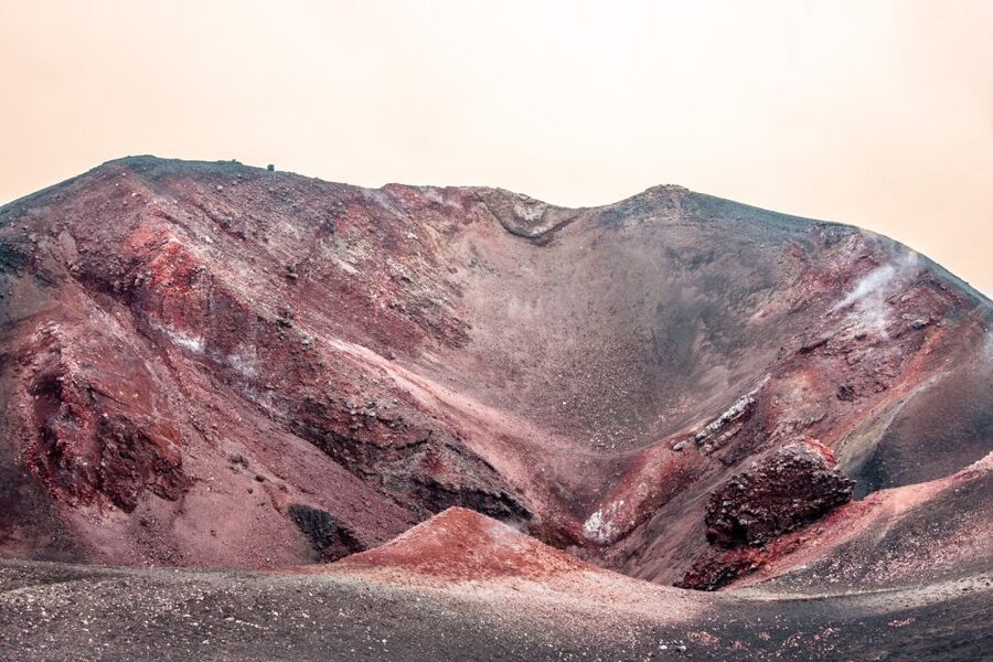 From Catania: Mount Etna Sunset Tour - Looking into a volcanic cave