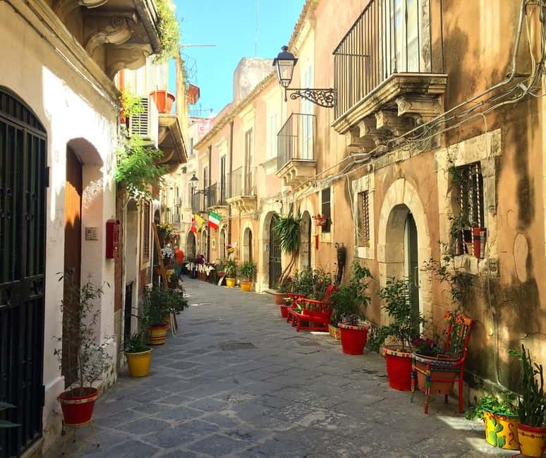 From Taormina: Syracuse Tour with lunch in Food Market - The Apollo Temple gives you the first jolt of history