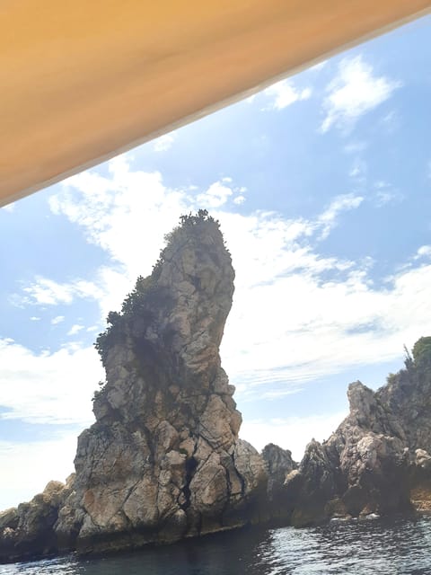 Giardini Naxos: Isola Bella and Grottos Cruise with Aperitif - Prosecco, almond paste, and a view of Isola Bella