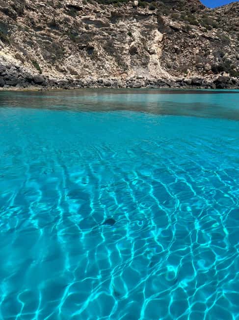 Lampedusa: Boat Cruise with Swimming Stops and Italian Lunch - Lunch served aboard the boat