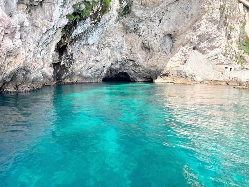 Naxos: Taormina Boat Tour with Snorkeling and Prosecco - Prosecco, fruit, and a lively boat atmosphere