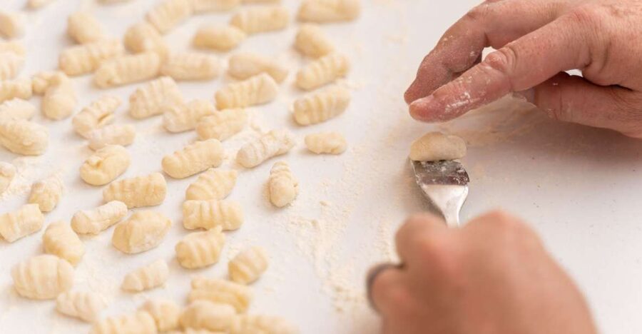 Palermo: Private Pasta and Tiramisu Class at a Local's Home - Cooking pasta in a Palermo home