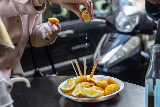 Palermo Street Food & Market Tour by Eating Europe - Entering Ballarò through the Arch of Cutò