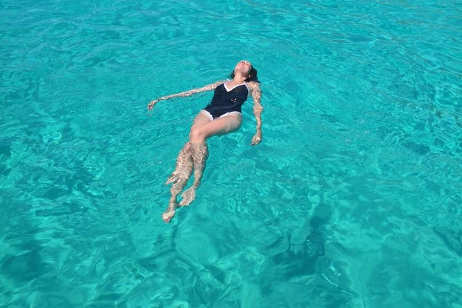 Private Tour Half Day Boat Trip in Favignana from Trapani - Cala Rossa: clear water beside old stone