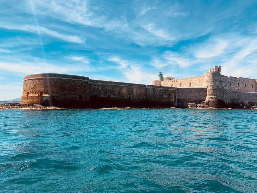 Syracuse: Private boat tour of Ortigia and sea caves - Passing the Umbertine Bridge and Ortigia’s walls