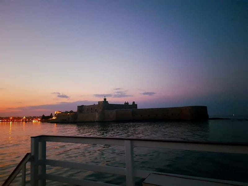 Syracuse: Sunset cruise including aperitif and swim stop - Sea caves and unusual rocks on Syracuse’s north side