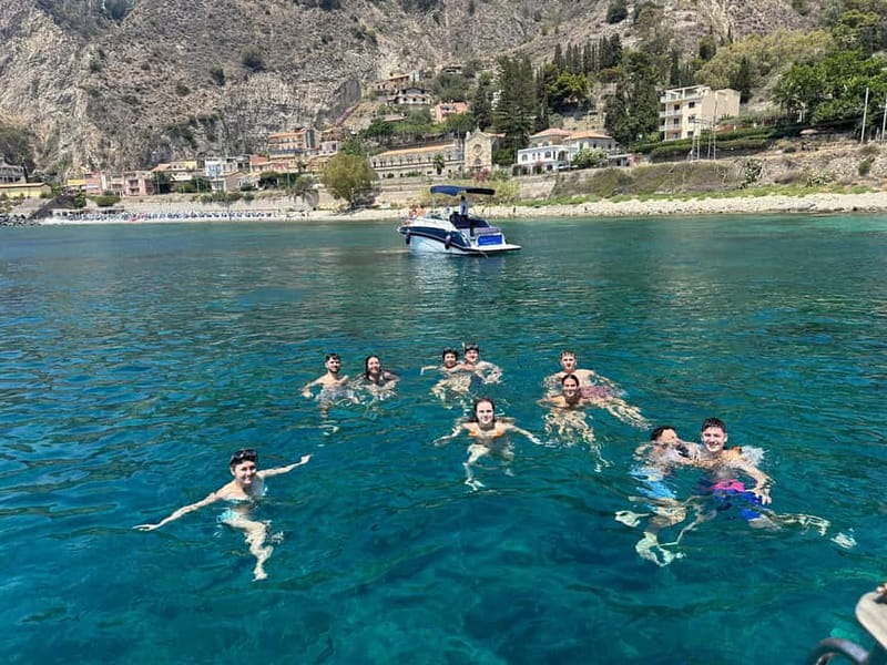 Taormina: Boat Tour with Sicilian Wine Tasting - Finding the boat at Spisone Beach