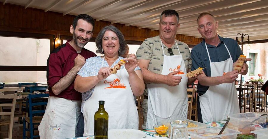 Taormina: Sicilian Cooking Class w/ a Visit to Local Market - Sitting down to eat what you made