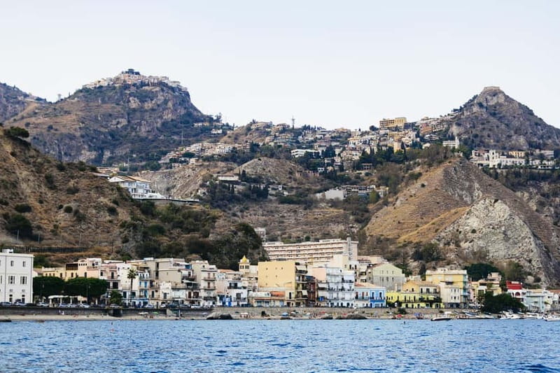 Taormina: Sunset Boat Tour with Dolphin Watching & Aperitif - The sea caves: Grotta del Giorno to Grotta del Corallo