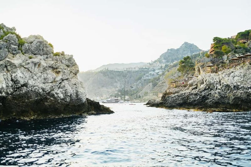 Taormina: Sunset Boat Tour with Dolphin Watching & Aperitif - Isola Bella and the swimming stop
