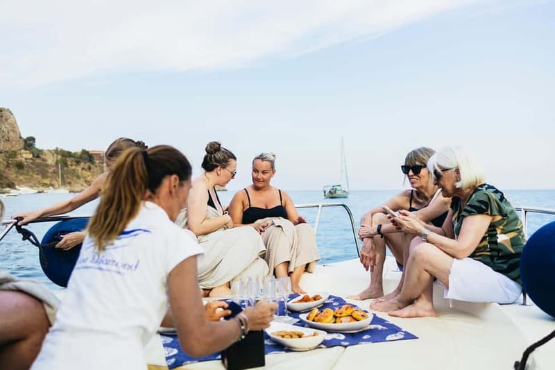 Taormina: Sunset Boat Tour with Dolphin Watching & Aperitif - Mazzaro Bay, San Nicola Bay, and the sunset