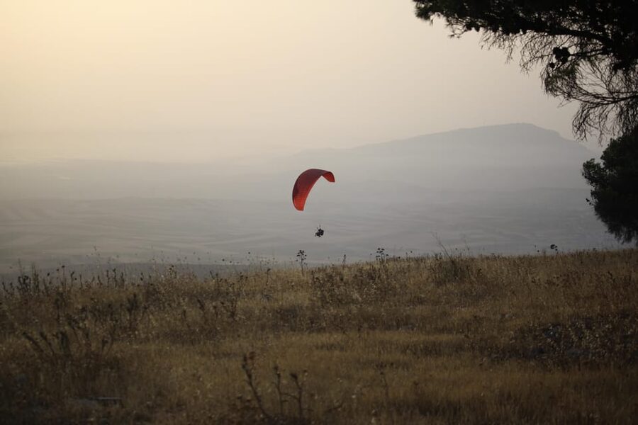 Trapani: Paragliding flight with GoPro photos and videos - Transport between landing and takeoff